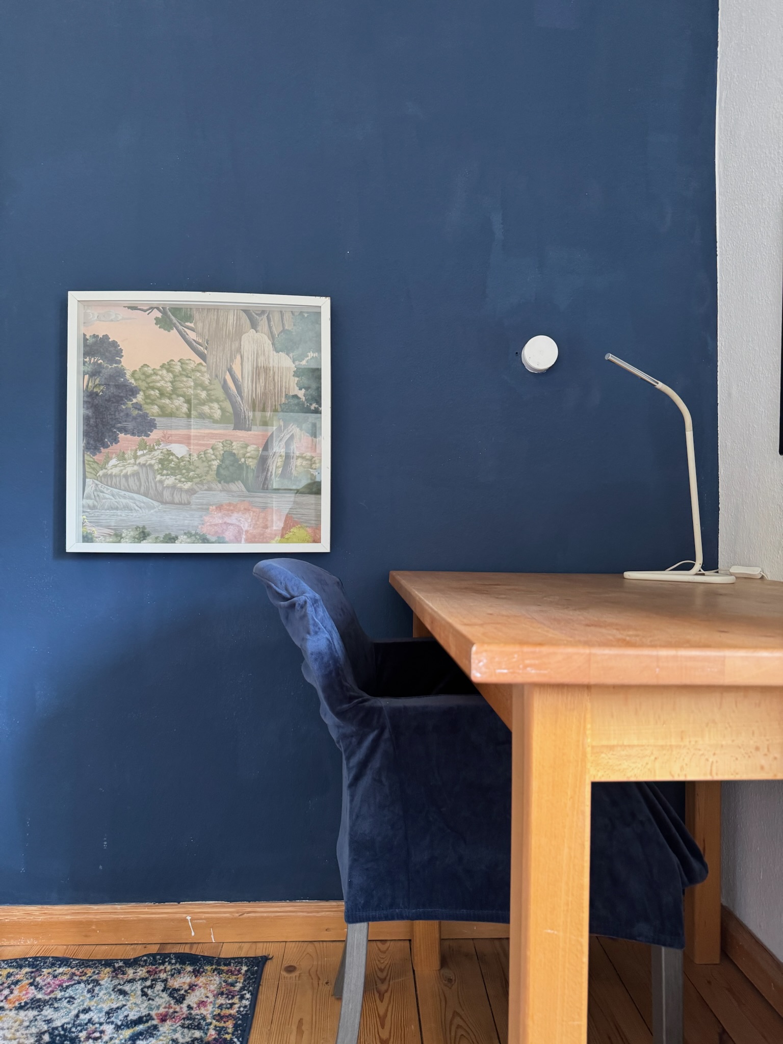 Desk against dark blue wall
