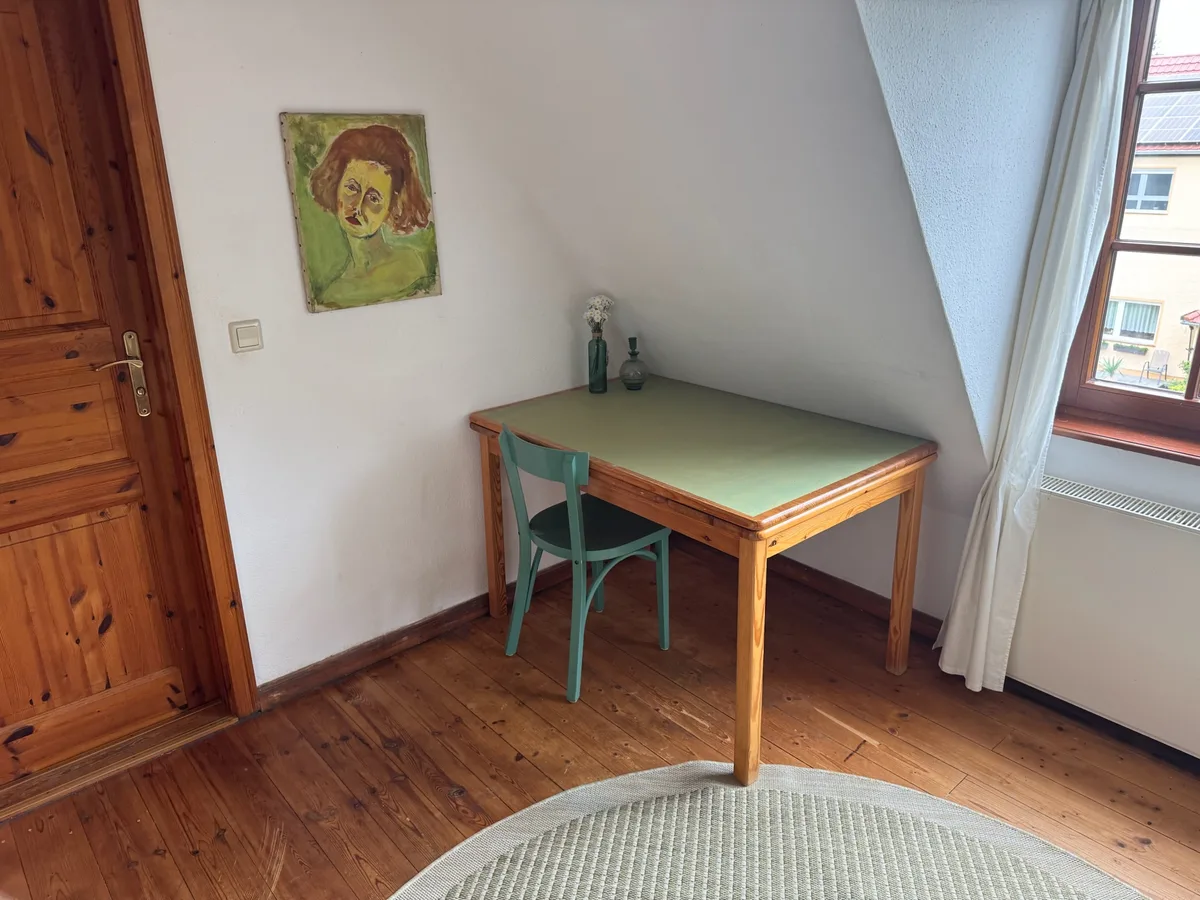 Green desk near window