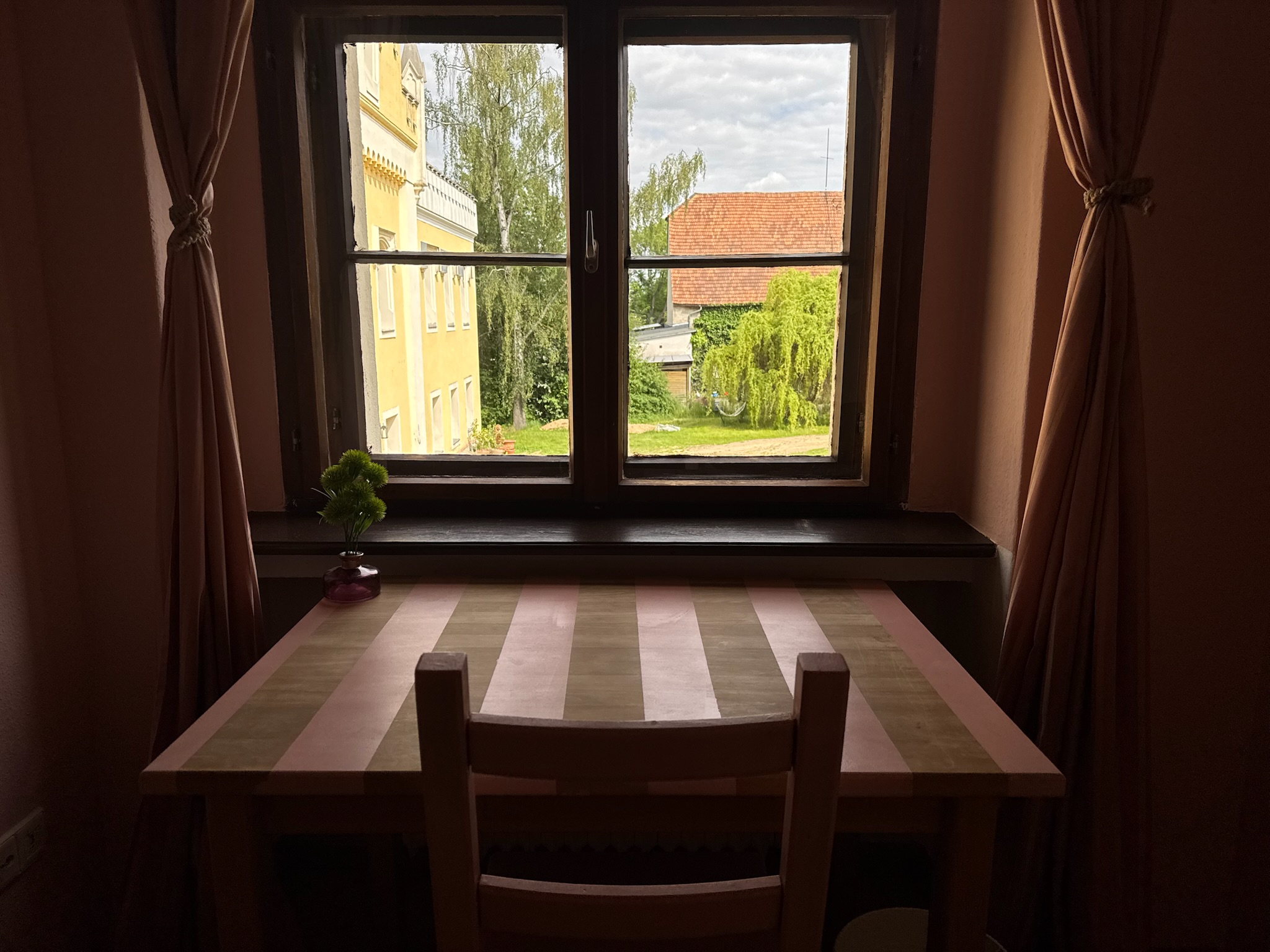 Pink desk facing window